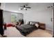 Bedroom with large windows, tray ceilings, and a ceiling fan at 5108 Sailwind Cir, Orlando, FL 32810