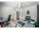 This bonus bedroom has a couch and desk, great for a home office or entertainment at 5108 Sailwind Cir, Orlando, FL 32810