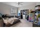 Bedroom featuring a well-organized closet, ceiling fan, and a window letting in plenty of light at 5108 Sailwind Cir, Orlando, FL 32810