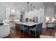 A spacious kitchen features an oversized island with bar seating, stainless steel appliances, and ample cabinet space at 5108 Sailwind Cir, Orlando, FL 32810