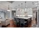 A spacious kitchen features an oversized island with bar seating, stainless steel appliances, and ample cabinet space at 5108 Sailwind Cir, Orlando, FL 32810