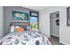 A cozy bedroom with a fun, space-themed decor, closet, and natural light at 5113 Forget Me Not Ave, Lake Hamilton, FL 33851