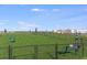 Well-maintained dog park with a bench, waste station, and secure fencing for a safe pet-friendly environment at 5113 Forget Me Not Ave, Lake Hamilton, FL 33851