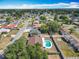 An aerial shows the homes in the neighborhood, including one with a delightful backyard pool at 601 Francis St, Kissimmee, FL 34741