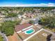 A lovely home is revealed in this aerial shot showing off the pool and screened-in lanai at 601 Francis St, Kissimmee, FL 34741