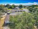 Back of the house, white privacy fence, and serene neighborhood setting in this beautiful aerial perspective at 601 Francis St, Kissimmee, FL 34741