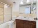 Bathroom with vanity, toilet, shower, and updated fixtures at 601 Francis St, Kissimmee, FL 34741