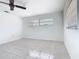 Bedroom with ceiling fan and tile floor, good natural light at 601 Francis St, Kissimmee, FL 34741