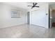Bedroom with a window, fan and plenty of closet space at 601 Francis St, Kissimmee, FL 34741