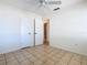 Tile-floored bedroom with two closets and bathroom access, offering ample storage and convenience at 601 Francis St, Kissimmee, FL 34741