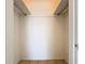 Neutral closet with tile floor provides ample storage at 601 Francis St, Kissimmee, FL 34741