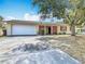 Lovely single-story home with attached garage, a well-manicured lawn, and a charming design at 601 Francis St, Kissimmee, FL 34741