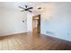 Open living room featuring tile flooring, ceiling fan, and bright lighting, creating an inviting and airy atmosphere at 601 Francis St, Kissimmee, FL 34741