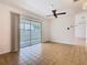 Bright living area featuring tile floors and sliding glass doors leading to the outdoor patio, offering a seamless transition at 601 Francis St, Kissimmee, FL 34741