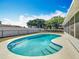 Backyard features an in-ground kidney-shaped pool with tile trim and integrated steps at 601 Francis St, Kissimmee, FL 34741