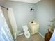 The full bathroom is equipped with a toilet, vanity, and shower/tub combo at 606 E Central Ave, Eagle Lake, FL 33839