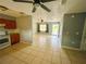 Inviting living room featuring neutral paint, tiled floors, and plenty of natural light at 606 E Central Ave, Eagle Lake, FL 33839