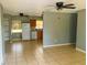 Open-concept living area with tile flooring seamlessly connecting to the kitchen at 606 E Central Ave, Eagle Lake, FL 33839