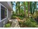 Beautiful landscaping and mature trees surround the backyard walkway at 617 Red Oak Cir # 121, Altamonte Springs, FL 32701