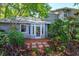 Lovely backyard features a brick patio and lush tropical landscaping at 617 Red Oak Cir # 121, Altamonte Springs, FL 32701