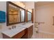 Bathroom featuring double sinks, wooden cabinets, and a luxurious tiled shower at 617 Red Oak Cir # 121, Altamonte Springs, FL 32701