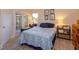 Cozy bedroom with a comfortable bed, soft lighting, and access to an enclosed porch at 617 Red Oak Cir # 121, Altamonte Springs, FL 32701