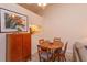 Cozy dining area with wood table and chairs, wood floors, and pass-through to kitchen at 617 Red Oak Cir # 121, Altamonte Springs, FL 32701
