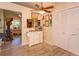 Kitchen with wood-look flooring, a ceiling fan and white cabinets at 617 Red Oak Cir # 121, Altamonte Springs, FL 32701