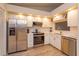 Modern kitchen features stainless steel appliances, white cabinetry, and recessed lighting at 617 Red Oak Cir # 121, Altamonte Springs, FL 32701