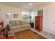 Cozy living room with a comfortable sofa, ceiling fan, and large windows for natural light at 617 Red Oak Cir # 121, Altamonte Springs, FL 32701