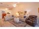 Bright living room featuring hardwood floors, neutral paint, and comfortable seating at 617 Red Oak Cir # 121, Altamonte Springs, FL 32701