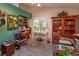 Office area with desk, shelves, and natural light from a large window at 617 Red Oak Cir # 121, Altamonte Springs, FL 32701