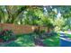 Brick signage at Oak Harbour, set in landscaped garden with pathway at 617 Red Oak Cir # 121, Altamonte Springs, FL 32701