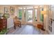 Bright sunroom featuring large windows, a rocking chair, and light wood flooring at 617 Red Oak Cir # 121, Altamonte Springs, FL 32701