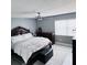Comfortable bedroom with a large bed, a ceiling fan, and soft lighting, creating a relaxing atmosphere at 6216 Beaumont Ave, Orlando, FL 32808