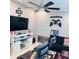 Cozy game room features a mounted flat-screen TV, comfortable seating, and decor that invites fun and entertainment at 6216 Beaumont Ave, Orlando, FL 32808