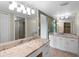 Bright bathroom with granite counters, dual vanity sinks, and a tile floor at 652 Lake Villas Dr # D, Altamonte Springs, FL 32701