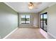 Bedroom featuring neutral paint, fan, lake view, carpet, and access to a screened patio at 652 Lake Villas Dr # D, Altamonte Springs, FL 32701