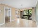 Bright dining room featuring tile flooring and a view into the kitchen and a screened in patio at 652 Lake Villas Dr # D, Altamonte Springs, FL 32701