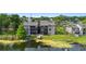 Lakefront condos feature lush landscaping, private balconies, and serene water views at 652 Lake Villas Dr # D, Altamonte Springs, FL 32701