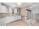 Bright kitchen featuring granite counters, stainless steel appliances, and views to the lanai at 652 Lake Villas Dr # D, Altamonte Springs, FL 32701