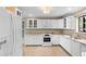 Well-lit kitchen featuring granite counters, white cabinets, and stainless steel appliances at 652 Lake Villas Dr # D, Altamonte Springs, FL 32701