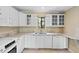 Well-lit kitchen featuring granite counters, stainless steel appliances, and white cabinetry at 652 Lake Villas Dr # D, Altamonte Springs, FL 32701