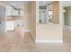 Modern kitchen featuring white cabinets and granite countertops, open to a spacious living area at 652 Lake Villas Dr # D, Altamonte Springs, FL 32701