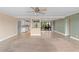 Bright and airy living room connected to the kitchen, with balcony access and serene water views at 652 Lake Villas Dr # D, Altamonte Springs, FL 32701