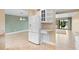 Living room with view to the lake, access to the lanai, neutral paint, and modern lighting at 652 Lake Villas Dr # D, Altamonte Springs, FL 32701