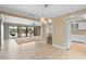 Open living and dining area with tile flooring, neutral paint, and view into the kitchen at 652 Lake Villas Dr # D, Altamonte Springs, FL 32701