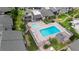 Community pool and lounge area surrounded by beautiful landscaping and seating at 652 Lake Villas Dr # D, Altamonte Springs, FL 32701