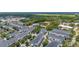 Expansive aerial view of a residential neighborhood with tree-lined streets and community recreational facilities at 704 Grado Pt, Oviedo, FL 32765