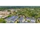 Scenic aerial view of homes surrounded by lush trees, highlighting a charming neighborhood atmosphere at 704 Grado Pt, Oviedo, FL 32765